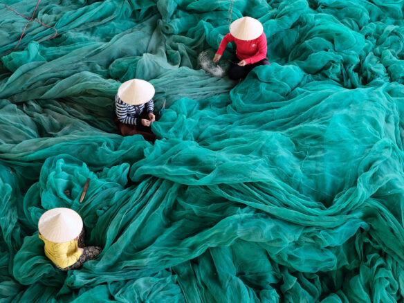 Women working with fishing nets.
