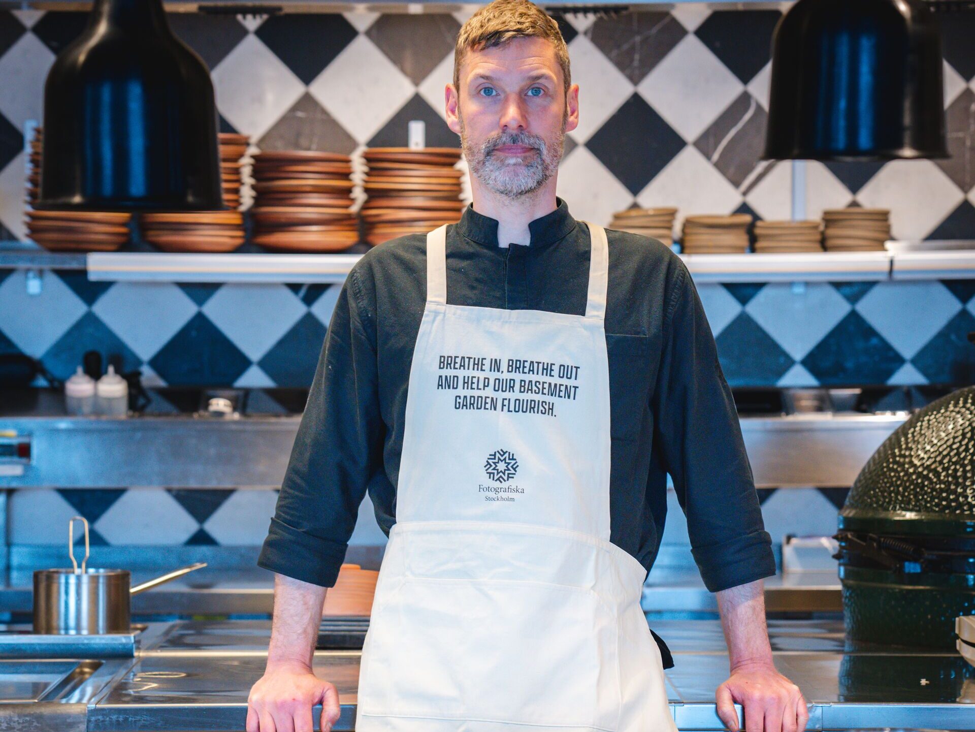 Martin Wall, Executive Chef at Fotografiska wearing an apron treated with Carbon Looper.